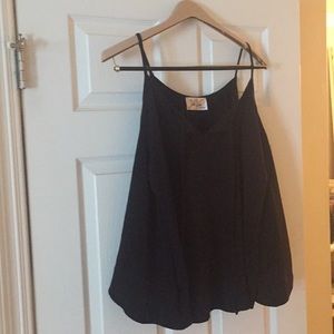 Fun & flirty black top. Great for all seasons!
